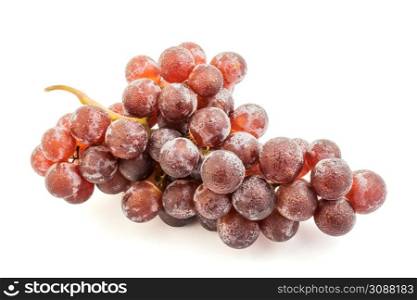 Ripe red grape. Pink bunch with leaves isolated on white.