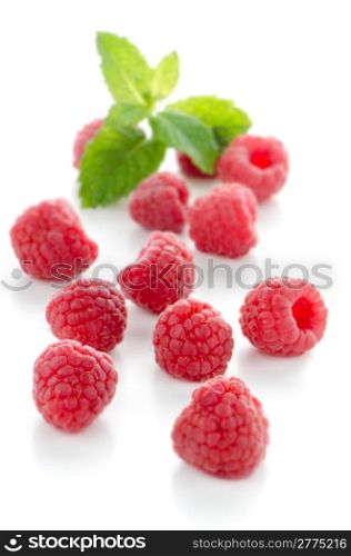 Ripe red raspberry on white background