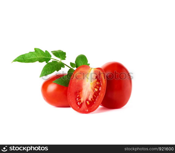 ripe red whole tomatoes and slices on a white background, autumn harvest for salad and cooking