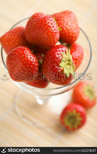 ripe strawberries in glass bowl