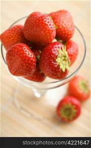 ripe strawberries in glass bowl