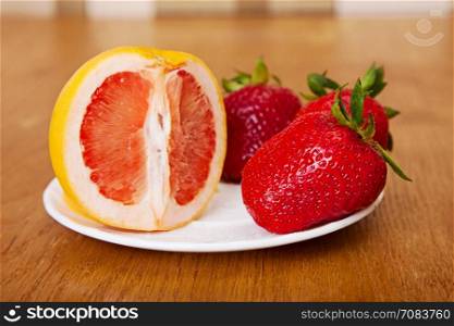 ripe strawberry on a wooden surface. fruit background