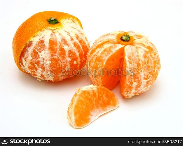 Ripe tangerines lie on a white background