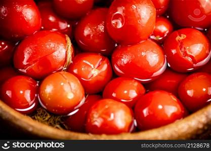 Ripe tomatoes for marinating in a plate. Macro background. High quality photo. Ripe tomatoes for marinating in a plate.
