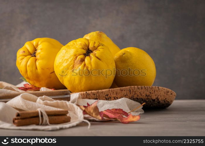 Ripe whole quinces. Fresh fruit for preparing recipes with cinnamon and lemon. An essential ingredient for a healthy diet