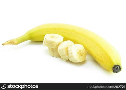 Ripe yellow bananas with sliced bananas on a white background