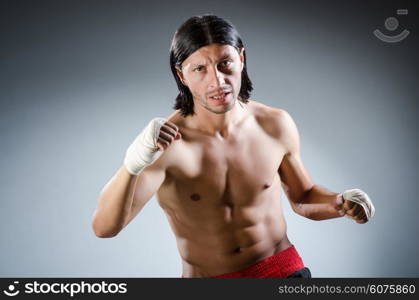 Ripped martial arts expert at training