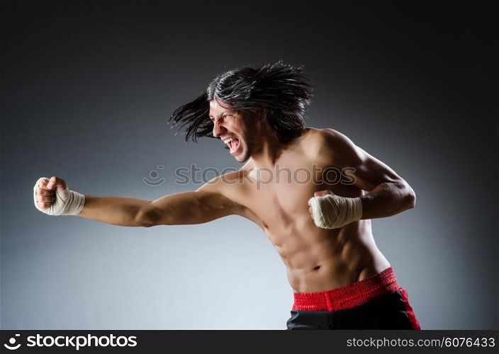 Ripped martial arts expert at training