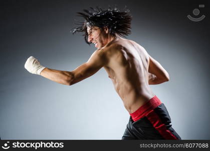 Ripped martial arts expert at training