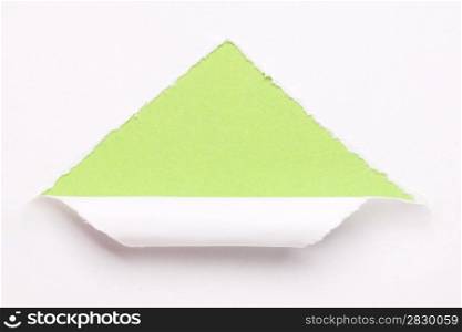 ripped white paper on a green background
