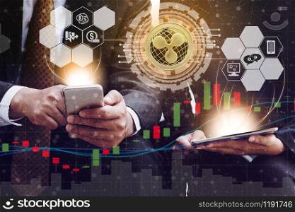 Ripple and cryptocurrency investing concept - Businessman using mobile phone application to trade Ripple XRP with another trader in modern graphic interface. Blockchain and financial technology.. Ripple XRP and Cryptocurrency Trading Concept