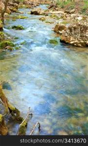 ripples and cascades on spring mountain river (Kokkozka River, Great Crimean Canyon, Ukraine). Long term exposure.