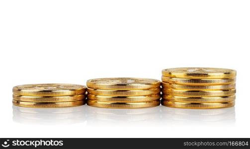 Rising stacks of coins isolated on white background. Golden bitcoins in a pile. The concept of income growth and crypto currency.. Rising stacks of coins isolated on white background