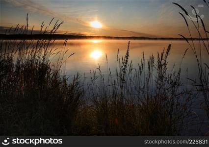 Rising sun at Codette Lake in Alberta