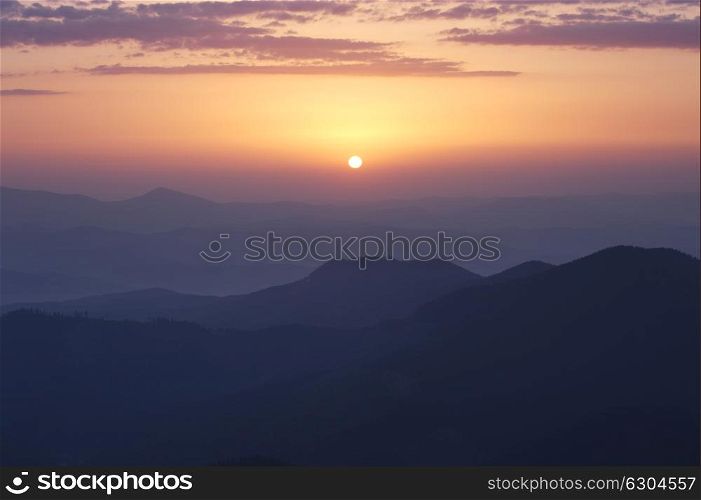 Rising sun under Carpathian mountains, Ukraine