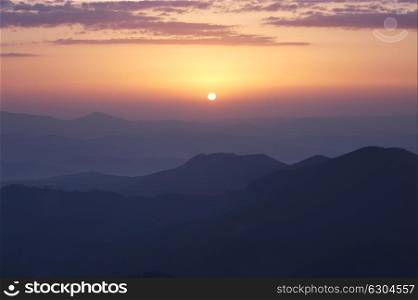 Rising sun under Carpathian mountains, Ukraine