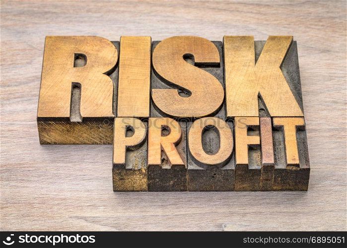 risk and profit word abstract in vintage letterpress wood type
