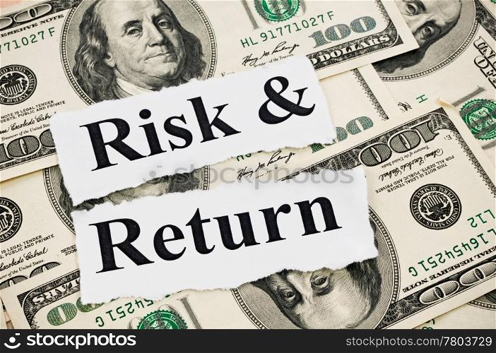 Risk and return words on hundreds US notes background