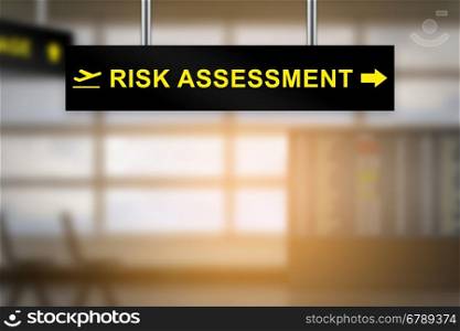 risk assessment on airport sign board with blurred background and copy space