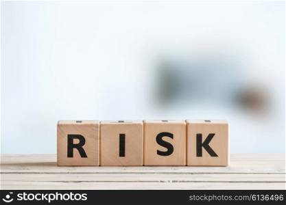 Risk message sign on a wooden office table