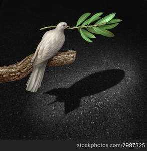 Risk of war concept as a freedom peace dove holding an olive branch casting a shadow that is shaped as a bomb as a symbol of the danger of warfare caused by hatred and political posturing.