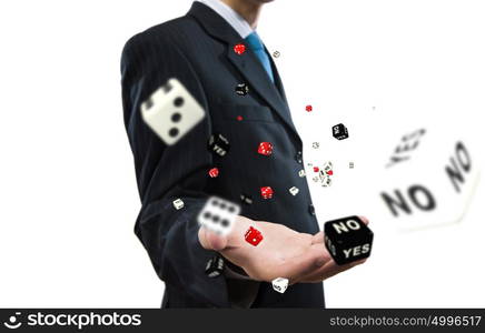 Risky business. Close up of businessman throwing dice. Gambling concept