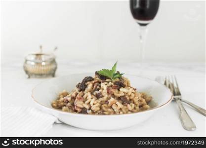 risotto with mushrooms coriander leaves. High resolution photo. risotto with mushrooms coriander leaves. High quality photo