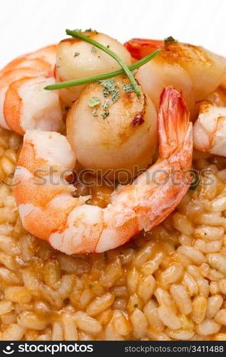 risotto with seafood sauce with scallops and prawns