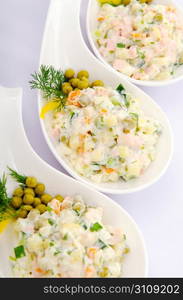 Riussian salad served in the plate