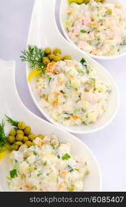 Riussian salad served in the plate