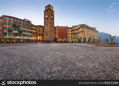 RIVA DEL GARDA, ITALY - JULY 4, 2017: Panorama of Piazza III November and Aponale Tower in the Morning, Riva del Garda, Italy. Lake Garda is the largest lake in Italy.