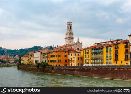 River Adige in cloudy summer day, Duomo tower in background, Verona, Italy