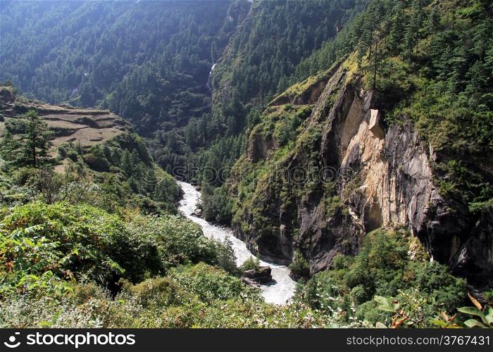 River and high green mountain in Nepal
