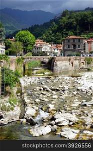 River and houses in Ceravezza, Italy
