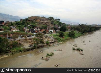 River and slum in the city Medelyn, Colombia