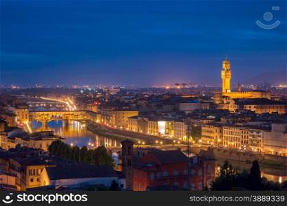 River Arno with bridge Ponte Vecchio and Palazzo Vecchio at night from Piazzale Michelangelo in Florence, Tuscany, Italy