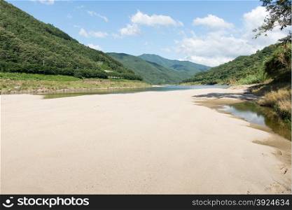 River bed landscape in South Korea. River bed landscape in South Korea with sandbank and green mountains
