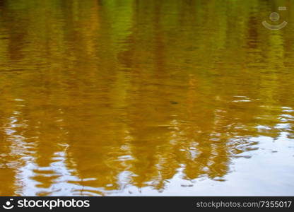 River color and reflections offshore in shallow water in Latvia as background. The Gauja is the longest river in Latvia, which is located only in the territory of Latvia.

