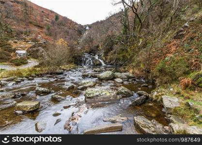 River Eiddew with Rhiwargor waterfall in the distance. Lake Vyrynwy, Powys, Wales UK, landscape