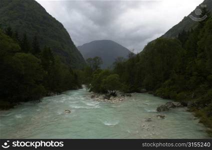River flowing between mountains in Slovenia