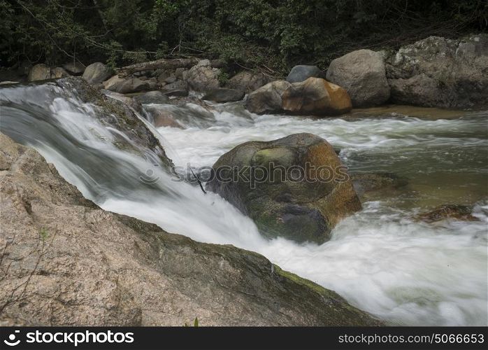 River flowing through rocks in forest, Yelapa, Jalisco, Mexico