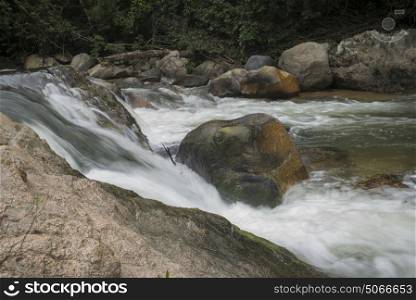 River flowing through rocks in forest, Yelapa, Jalisco, Mexico