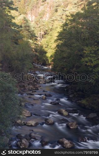 River Glaslyn running through alpine style valley. Beddgelert, Snowdonia, Gwynedd, Wales, United Kingdom? Long exposure.