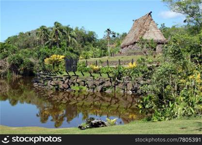 River, grass and traditional old house, Fiji