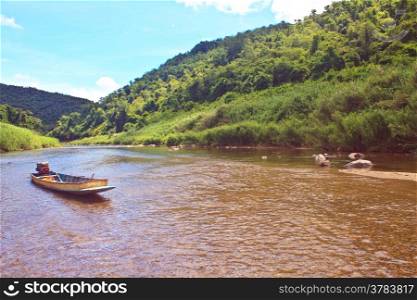 River in deep forest, river in evergreen forest with boat
