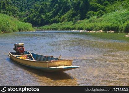 River in deep forest, river in evergreen forest with boat