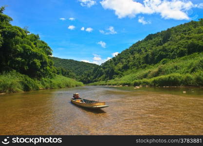 River in deep forest, river in evergreen forest with boat