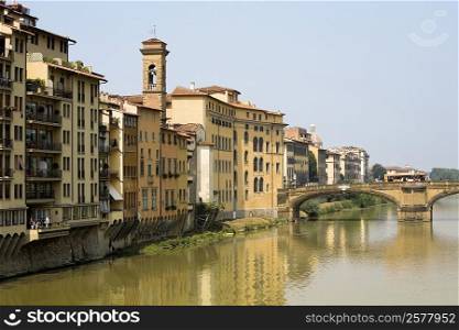 River in front of buildings, Ponte Alle Grazie, Arno River, Florence, Tuscany, Italy