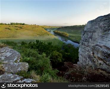 River in ravine on sunrise. View from above.. river in Russia