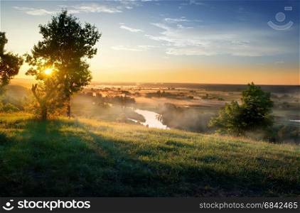 River in steppe at beautiful sunrise in summer